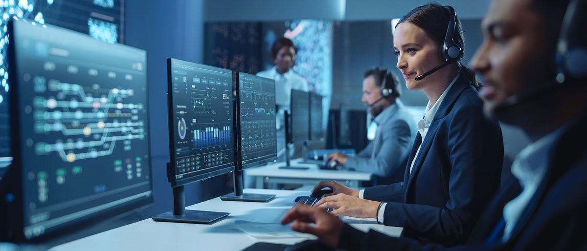 A woman assisting someone through a headset over the phone