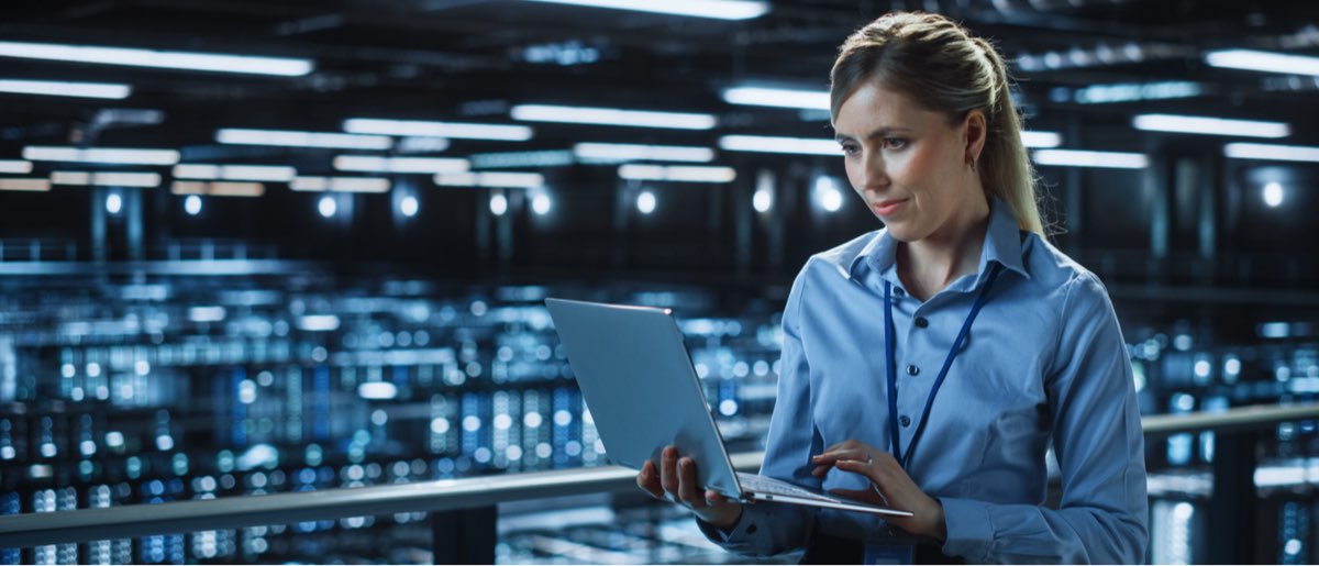 Woman on laptop in operations room