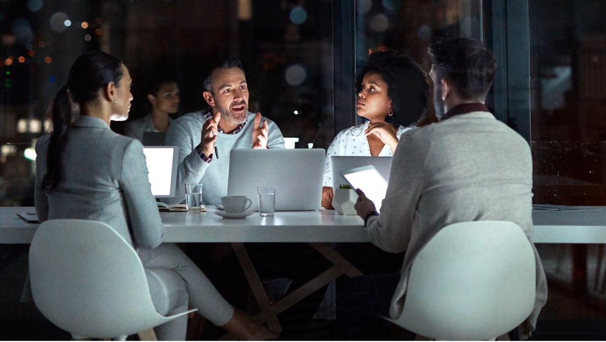 A team of IT experts at a roundtable