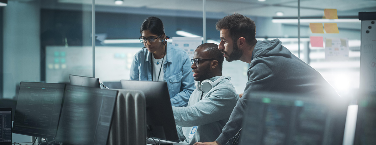 IT Team working together in front of computer